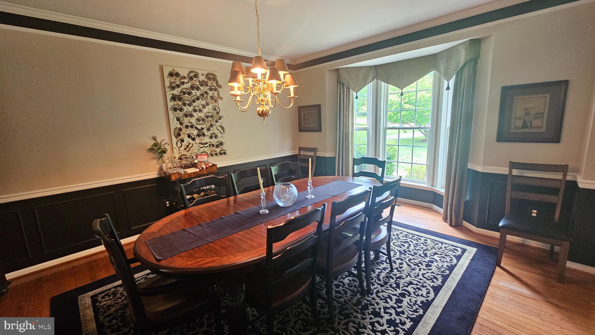 6107 Traceys Overlook Road Tracys Landing, MD 20779 - Photo 20 of 67 a view of a dining room with furniture and chandelier