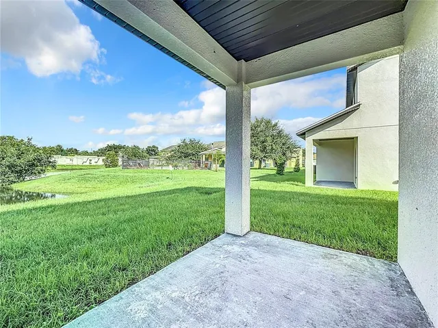 an aerial view of a house with a big yard