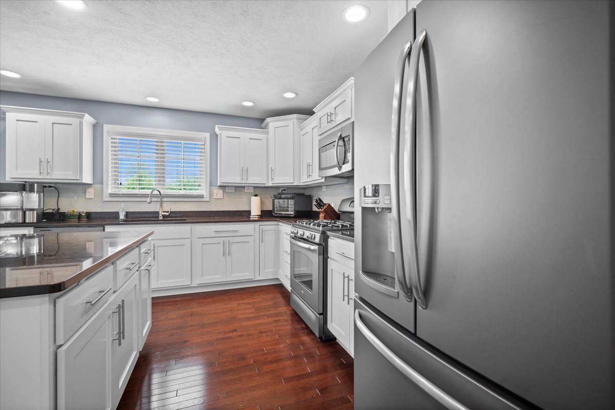 2321 Corrigan Way Normal, IL 61761 - Photo 11 of 33 a kitchen with stainless steel appliances granite countertop a refrigerator and a sink