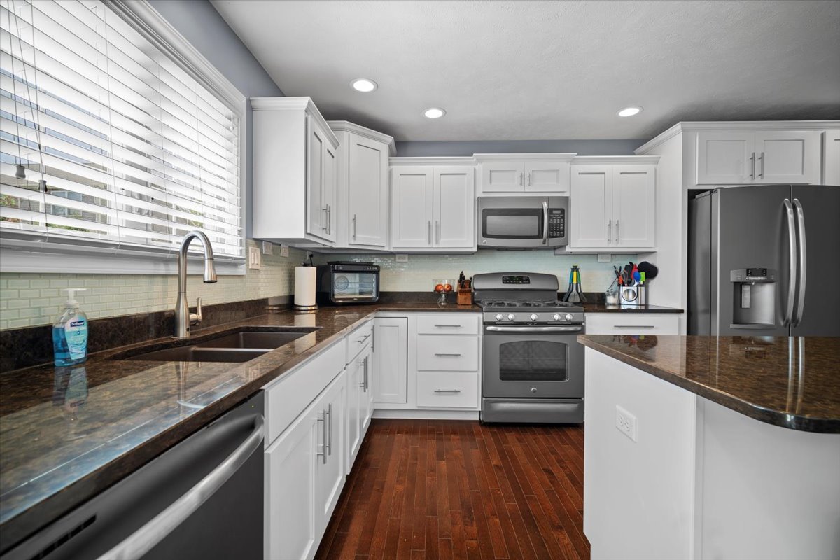 2321 Corrigan Way Normal, IL 61761 - Photo 14 of 33 a kitchen with stainless steel appliances granite countertop a stove sink and refrigerator