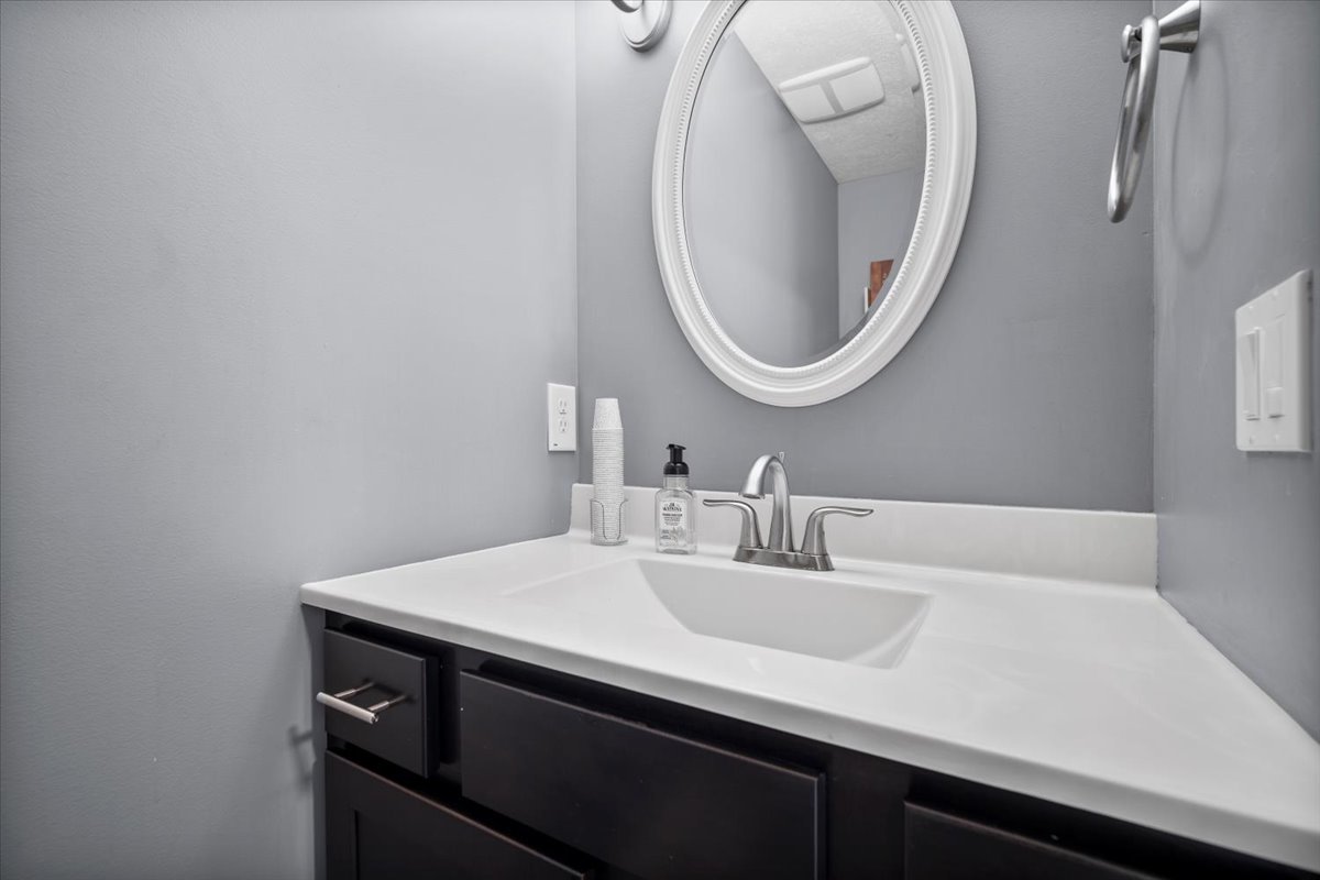 2321 Corrigan Way Normal, IL 61761 - Photo 15 of 33 a bathroom with a sink and a mirror