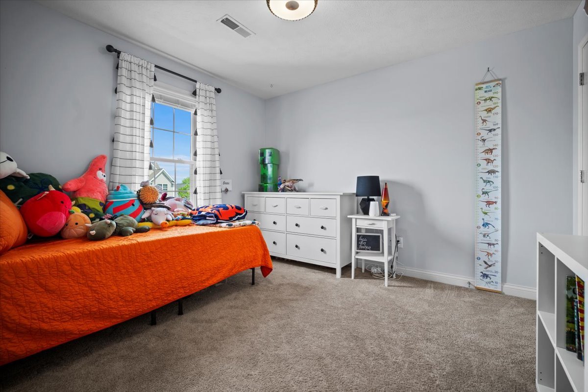 2321 Corrigan Way Normal, IL 61761 - Photo 17 of 33 a bed room with a bed and a window