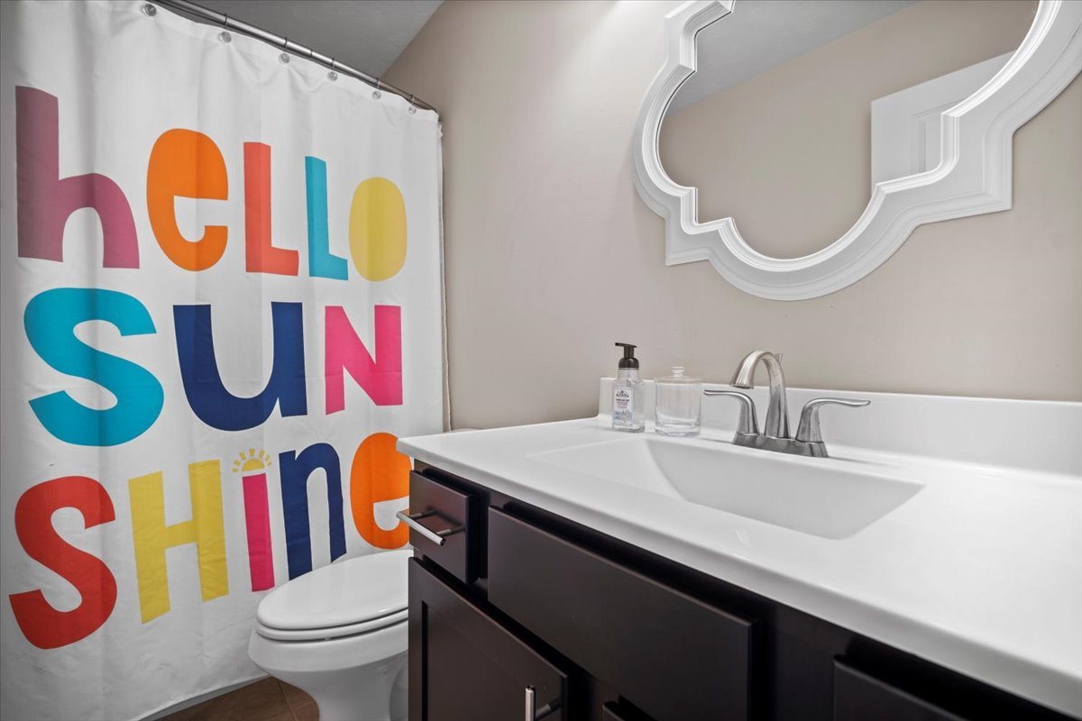 2321 Corrigan Way Normal, IL 61761 - Photo 19 of 33 a bathroom with a sink a mirror and a toilet