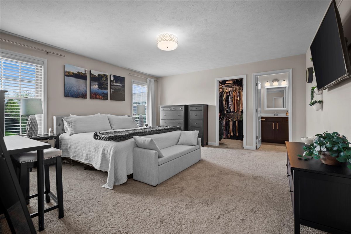 2321 Corrigan Way Normal, IL 61761 - Photo 20 of 33 a spacious bedroom with a bed and a flat screen television