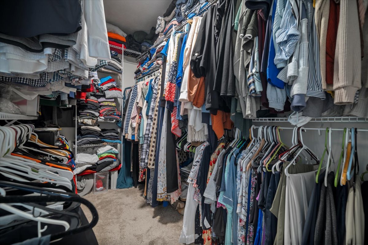 2321 Corrigan Way Normal, IL 61761 - Photo 21 of 33 a view of walk in closet with clothes and shoes