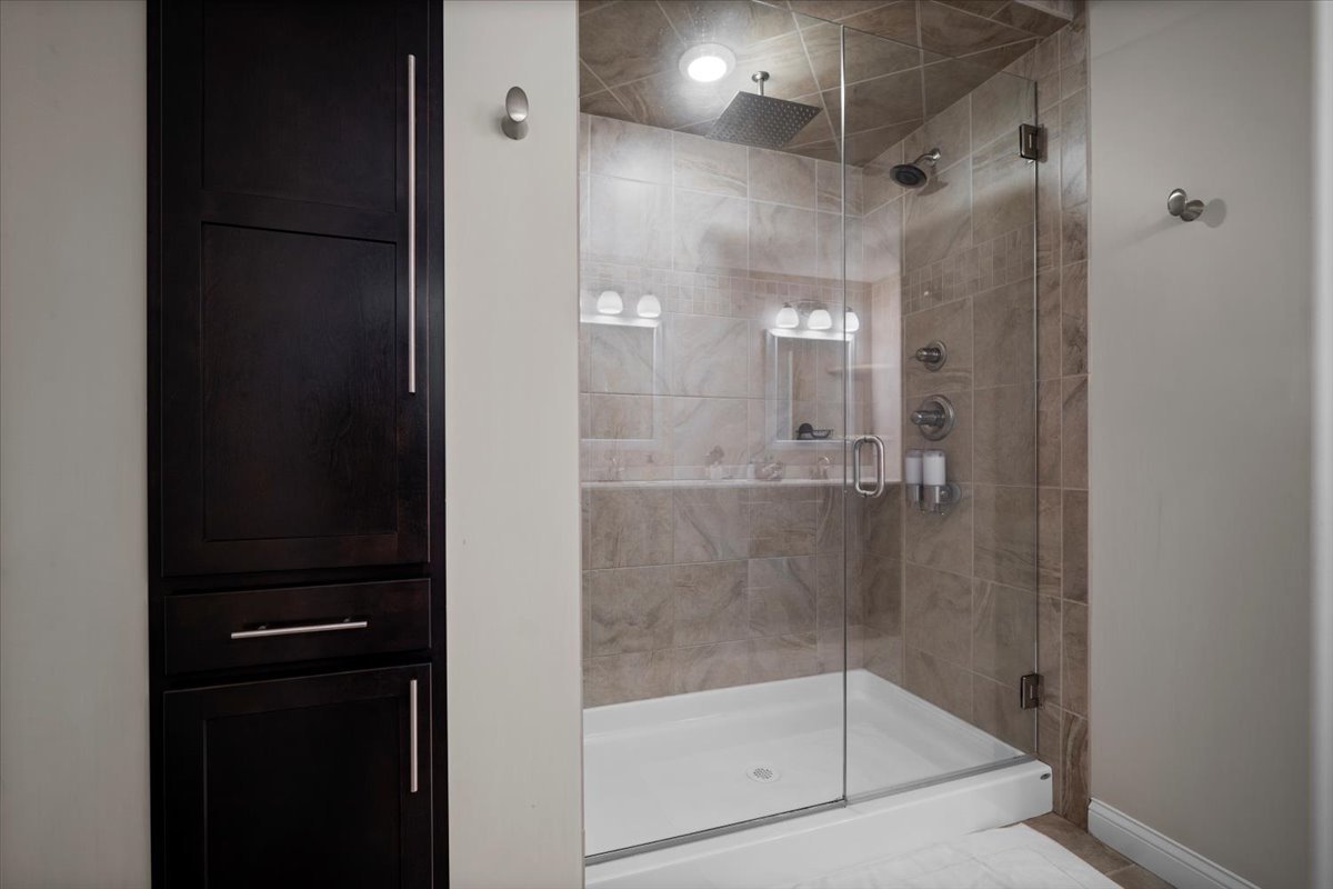 2321 Corrigan Way Normal, IL 61761 - Photo 23 of 33 a bathroom with a glass shower door