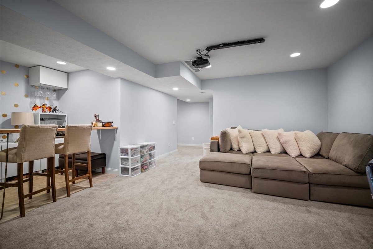 2321 Corrigan Way Normal, IL 61761 - Photo 28 of 33 a living room with furniture and a dining table with kitchen view