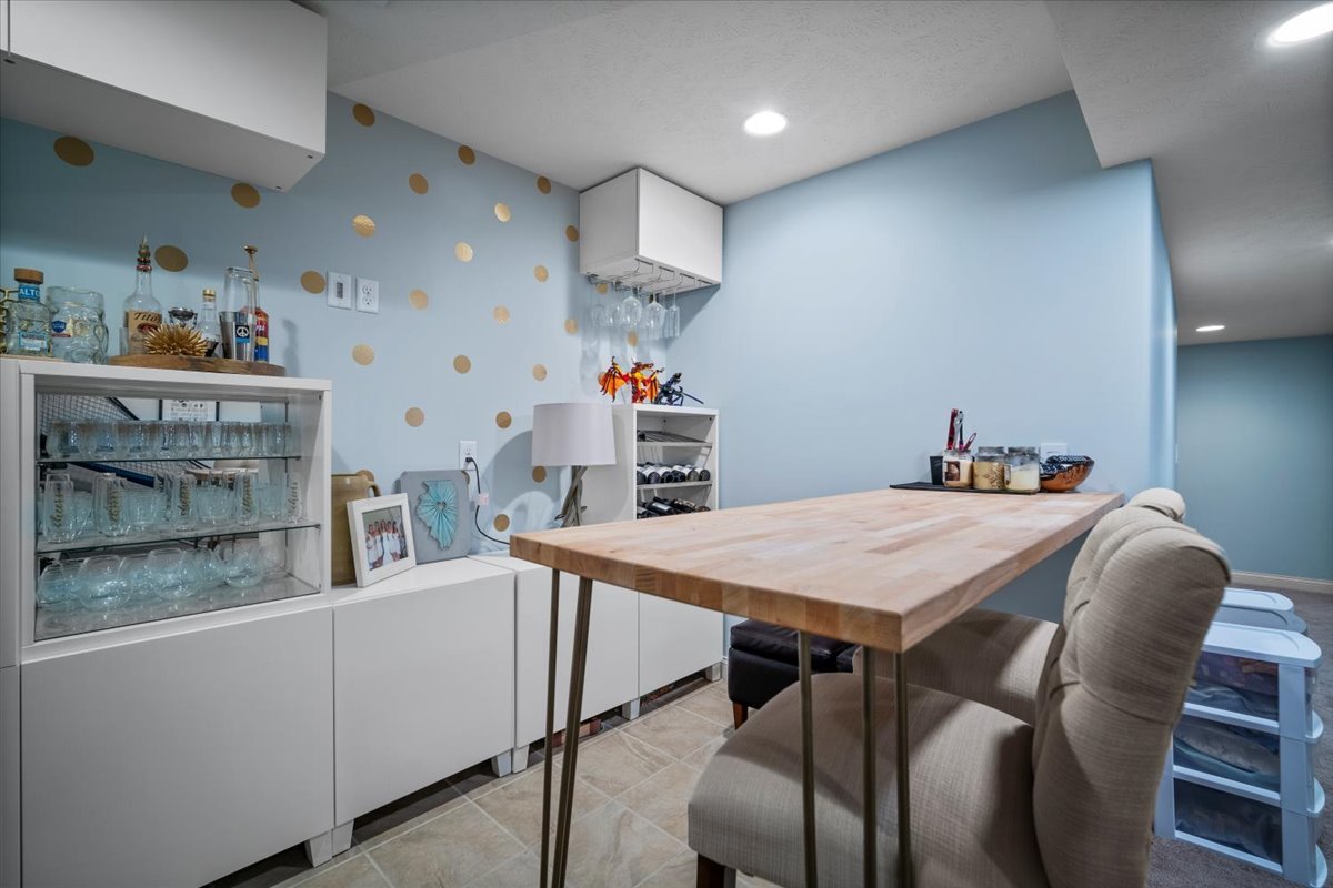 2321 Corrigan Way Normal, IL 61761 - Photo 29 of 33 a dining room with a wooden table and chairs