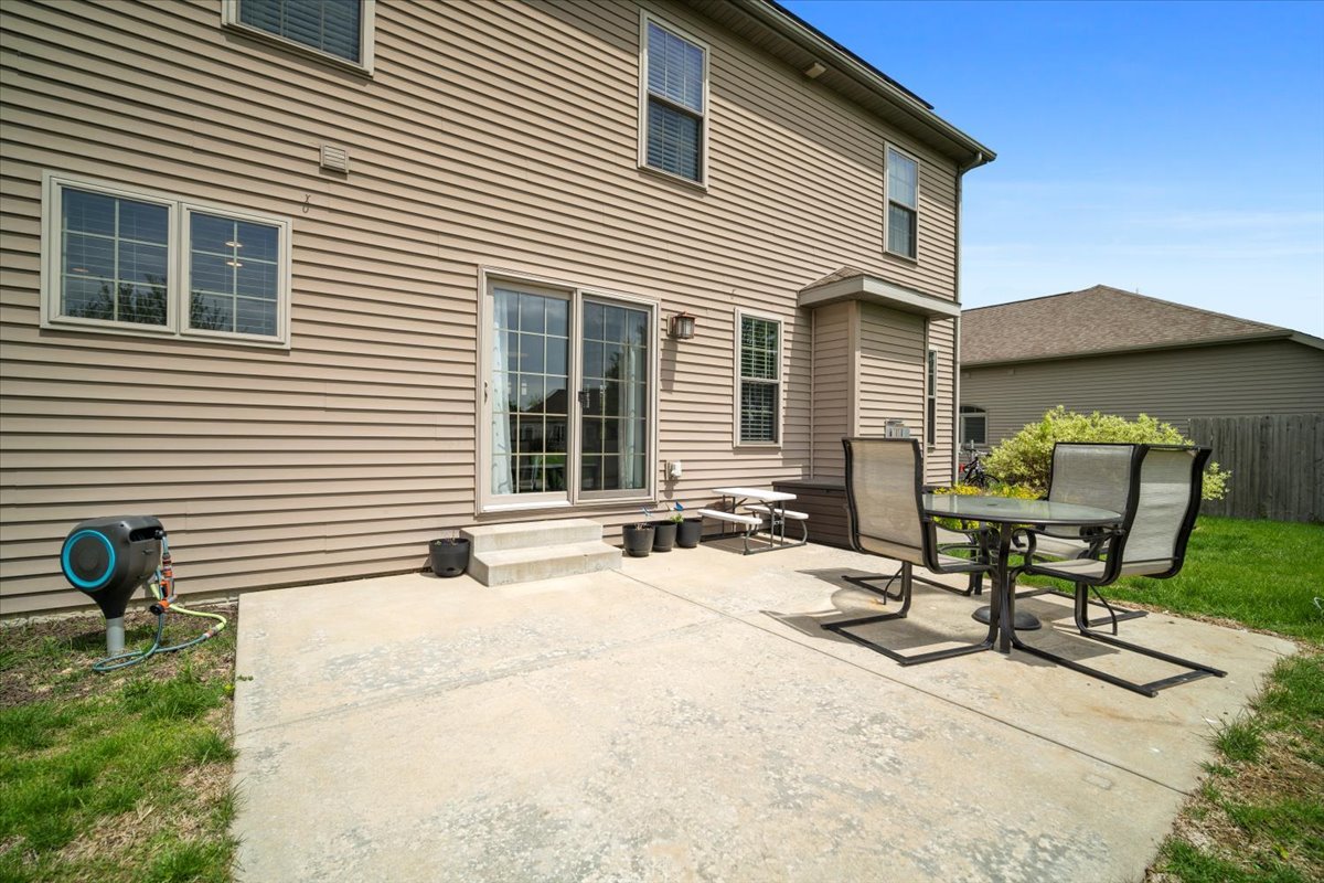 2321 Corrigan Way Normal, IL 61761 - Photo 30 of 33 a backyard of a house with table and chairs