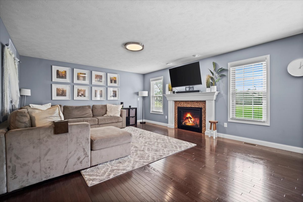 2321 Corrigan Way Normal, IL 61761 - Photo 5 of 33 a living room with furniture large window and a fireplace