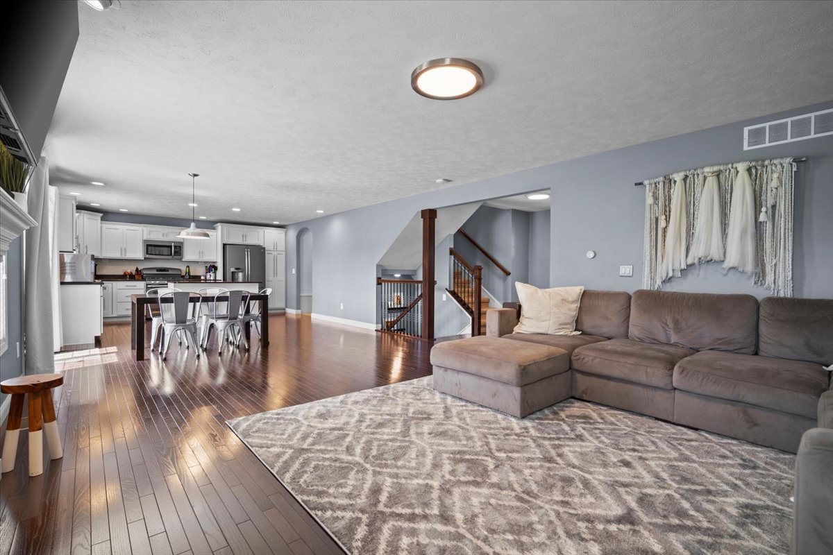 2321 Corrigan Way Normal, IL 61761 - Photo 7 of 33 a living room with furniture and a wooden floor