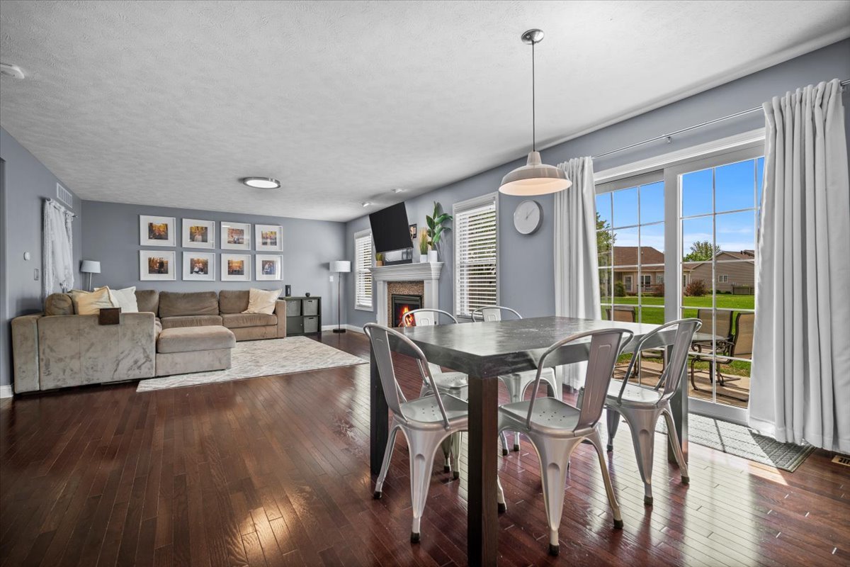 2321 Corrigan Way Normal, IL 61761 - Photo 9 of 33 a view of a dining room with furniture window and wooden floor