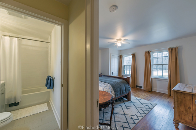 1727 Riverside Avenue St. Charles, IL 60174 - Photo 18 of 50 a spacious bedroom with a bed and wooden floor