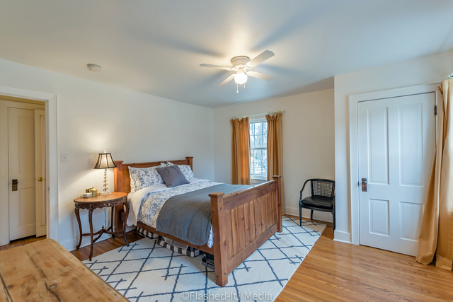 1727 Riverside Avenue St. Charles, IL 60174 - Photo 19 of 50 a bedroom with a bed and wooden floor