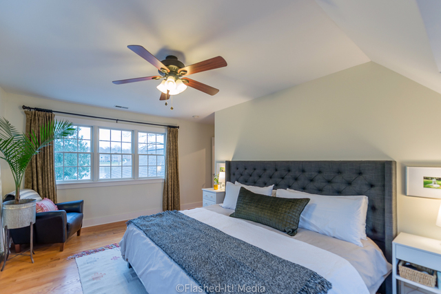 1727 Riverside Avenue St. Charles, IL 60174 - Photo 23 of 50 a bedroom with a bed chandelier and a window