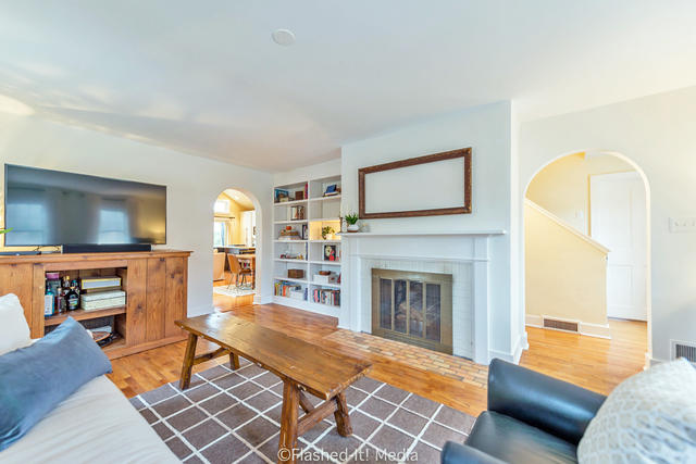 1727 Riverside Avenue St. Charles, IL 60174 - Photo 4 of 50 a living room with furniture and a fireplace