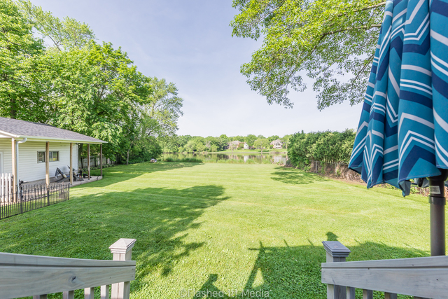 1727 Riverside Avenue St. Charles, IL 60174 - Photo 44 of 50 a view of a patio with table and chairs and potted plants with wooden floor and fence