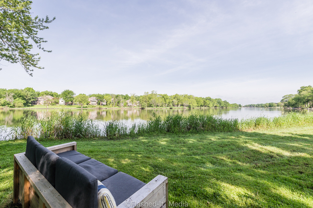 1727 Riverside Avenue St. Charles, IL 60174 - Photo 47 of 50 a view of a lake with green yard