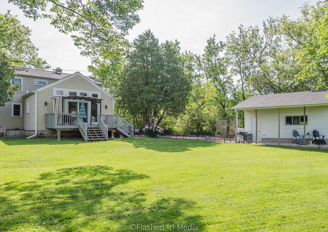 1727 Riverside Avenue St. Charles, IL 60174 - Photo 48 of 50 a view of a house with swimming pool and a yard