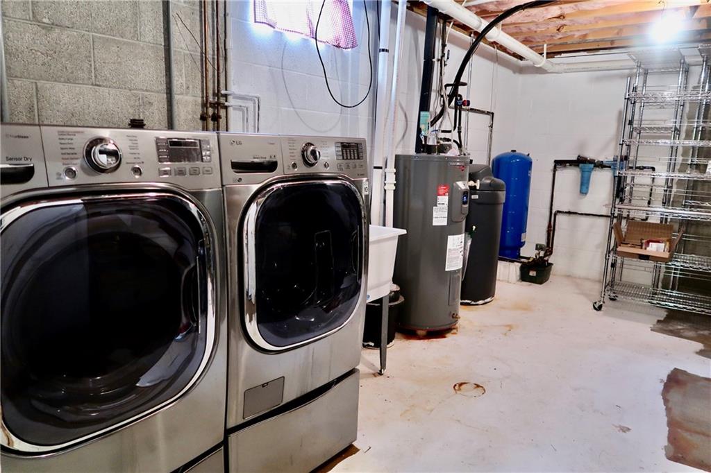 393 Hartwick Road Mercer, PA 16137 - Photo 23 of 50 a utility room with dryer and washer