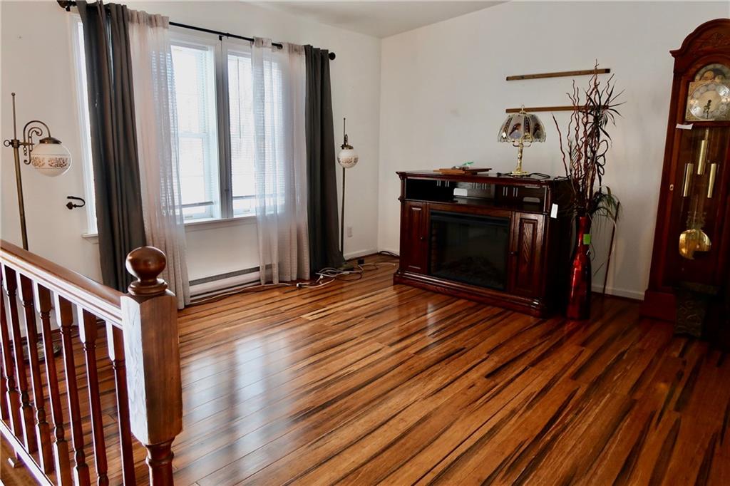 393 Hartwick Road Mercer, PA 16137 - Photo 6 of 50 a view of a hallway with wooden floor and stairs