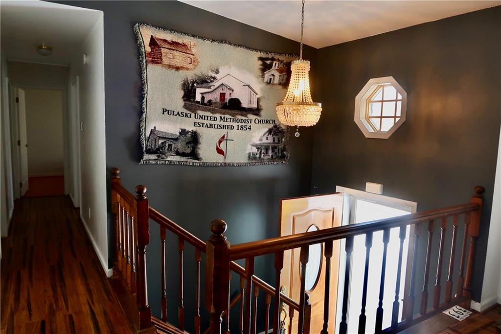 393 Hartwick Road Mercer, PA 16137 - Photo 7 of 50 a view of a hallway with wooden floor and windows