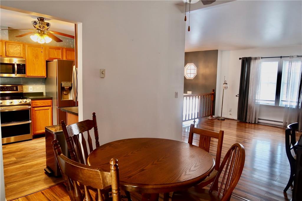 393 Hartwick Road Mercer, PA 16137 - Photo 9 of 50 a dining room with furniture and wooden floor
