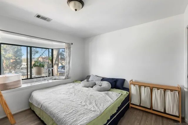 a bedroom with a bed and window