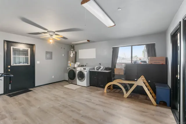 a view of a livingroom with furniture and a window