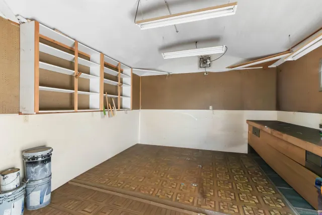 a view of a balcony with wooden floor and fence