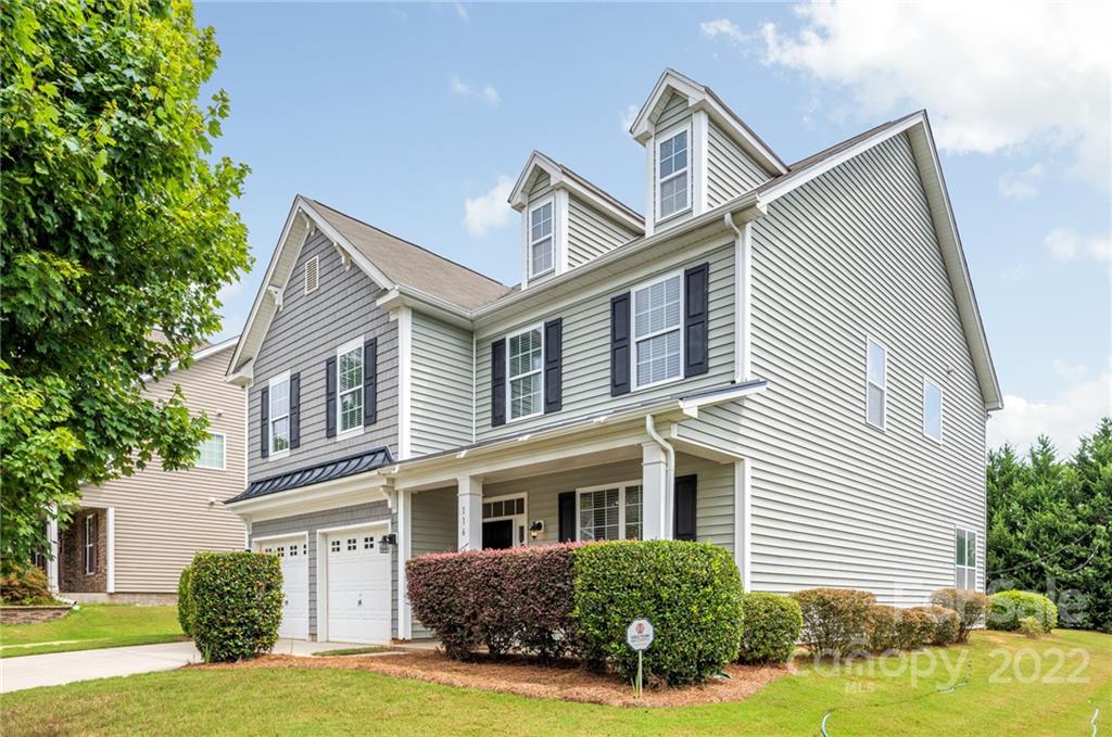 116 Annatto Way Tega Cay, SC 29708 - Photo 2 of 36 a front view of a house with a yard