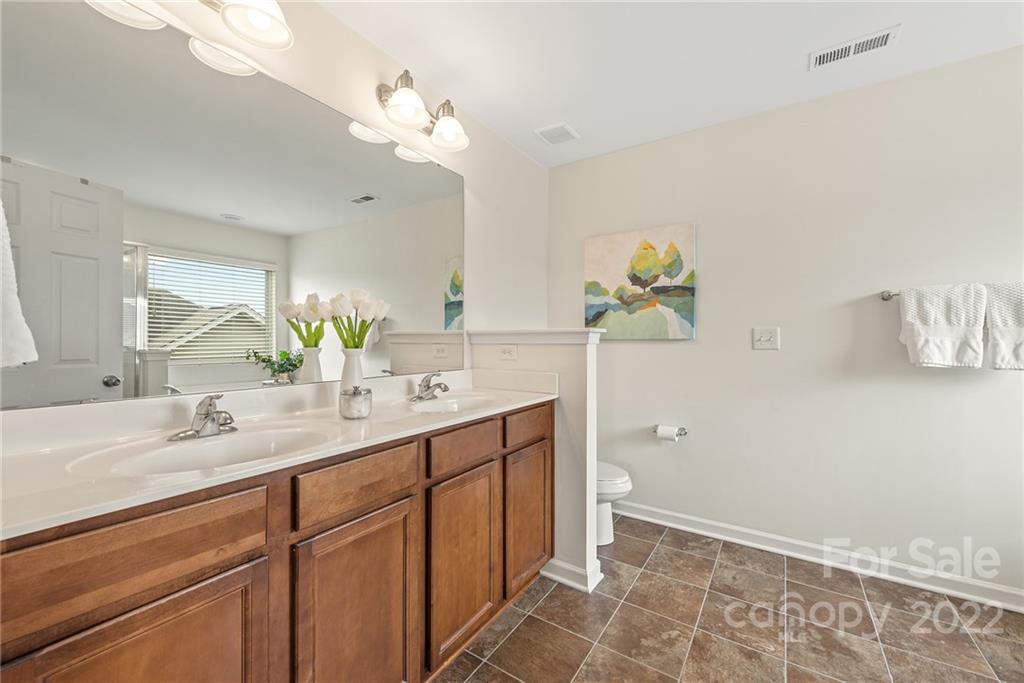 116 Annatto Way Tega Cay, SC 29708 - Photo 21 of 36 a spacious bathroom with a double vanity sink mirror and vanity