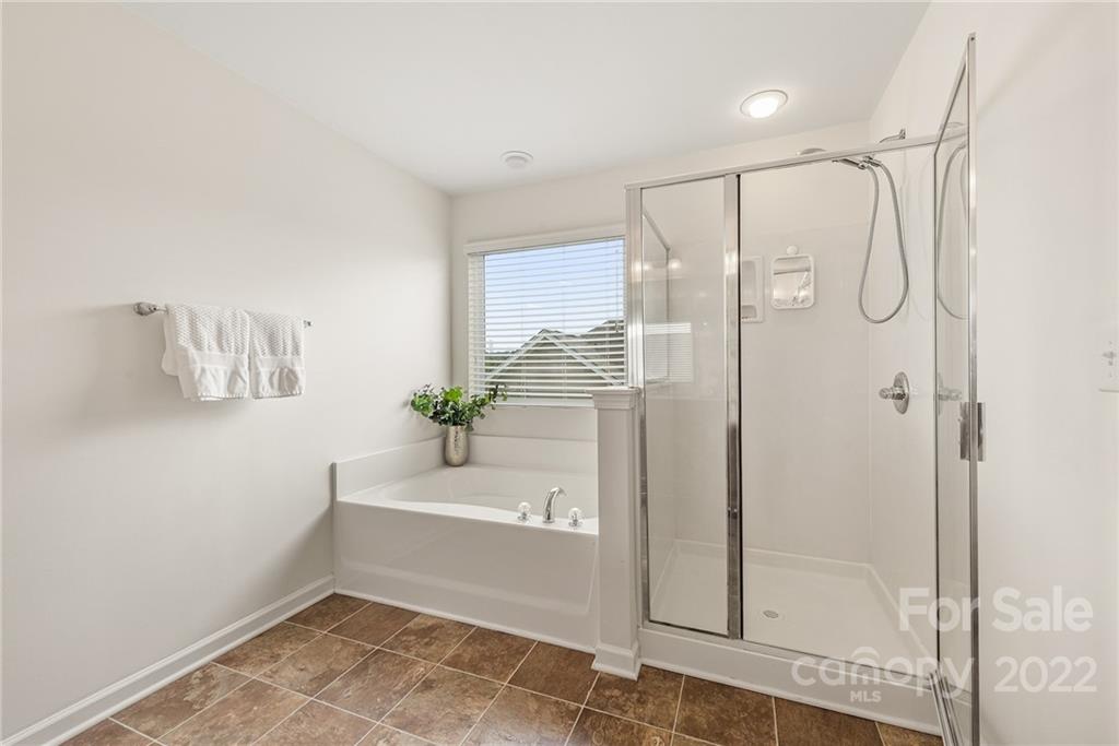 116 Annatto Way Tega Cay, SC 29708 - Photo 22 of 36 a bathroom with a shower and a sink