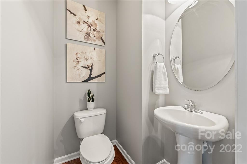 116 Annatto Way Tega Cay, SC 29708 - Photo 5 of 36 a bathroom with a toilet sink and mirror