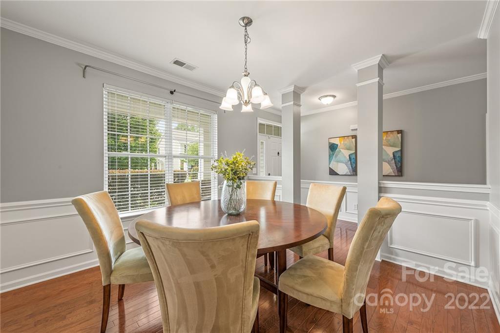 116 Annatto Way Tega Cay, SC 29708 - Photo 7 of 36 a dining room with furniture a chandelier and wooden floor
