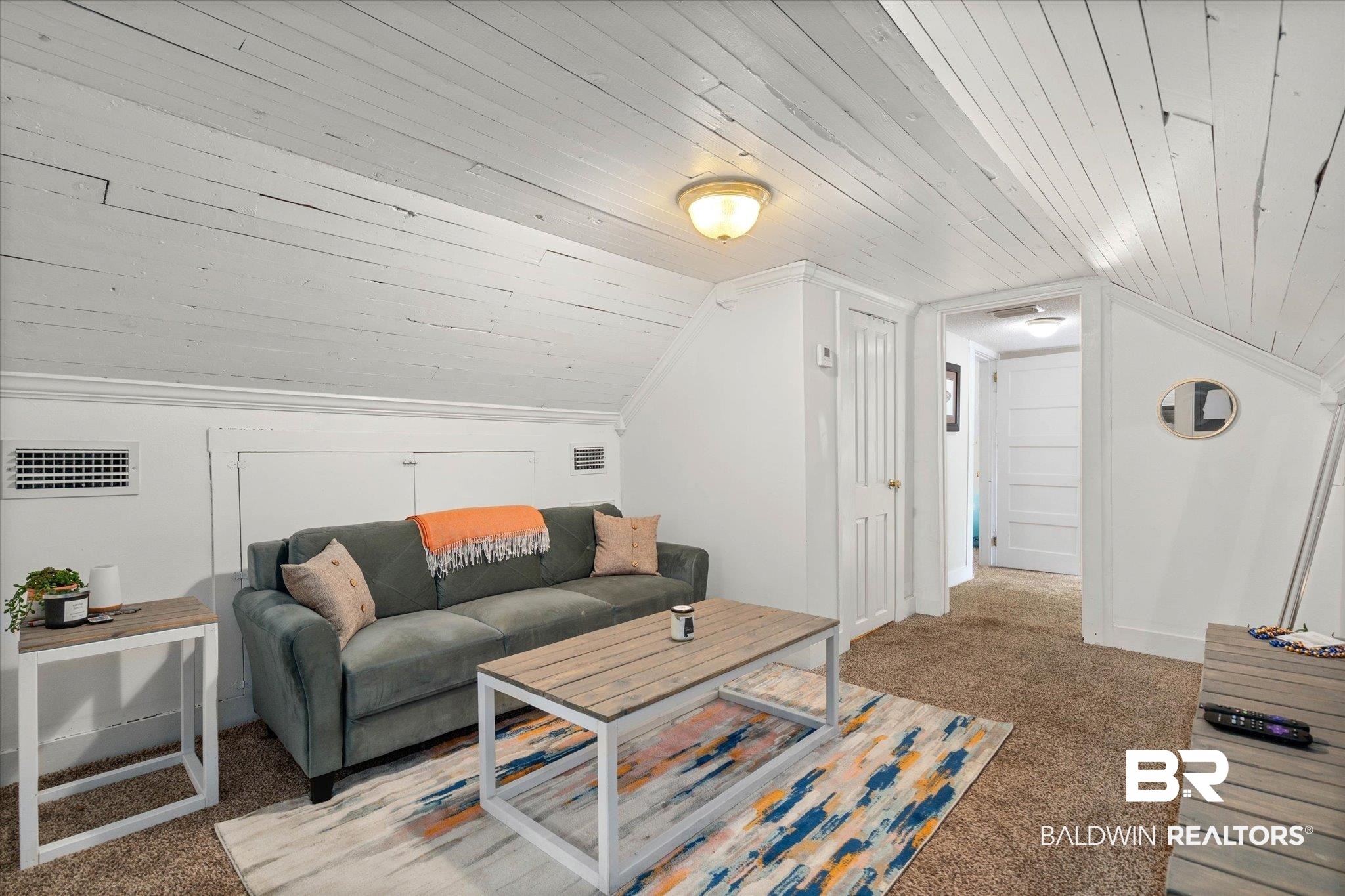 20 Hurlbert Street Mobile, AL 36607 - Photo 17 of 33 Living room featuring light carpet, wooden ceiling, and vaulted ceiling