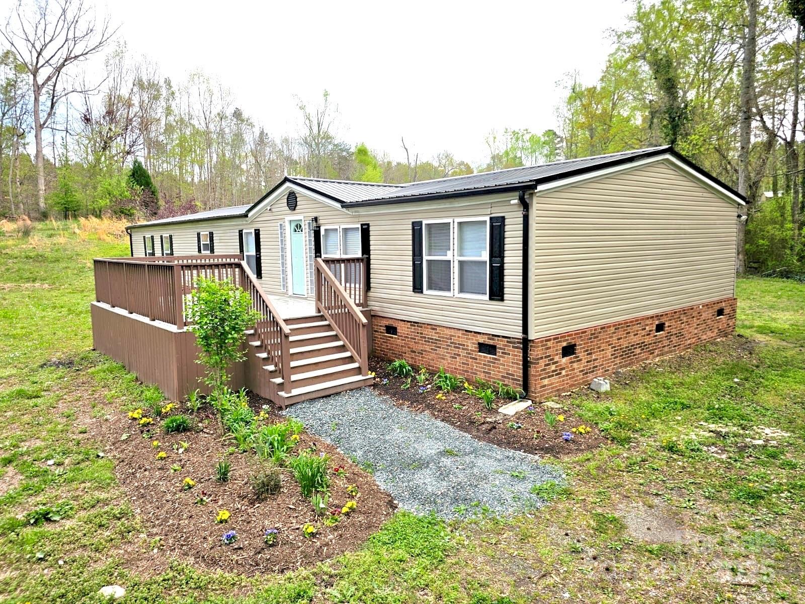 134 Watterson Road Grover, NC 28073 - Photo 1 of 19 a view of a house with wooden fence