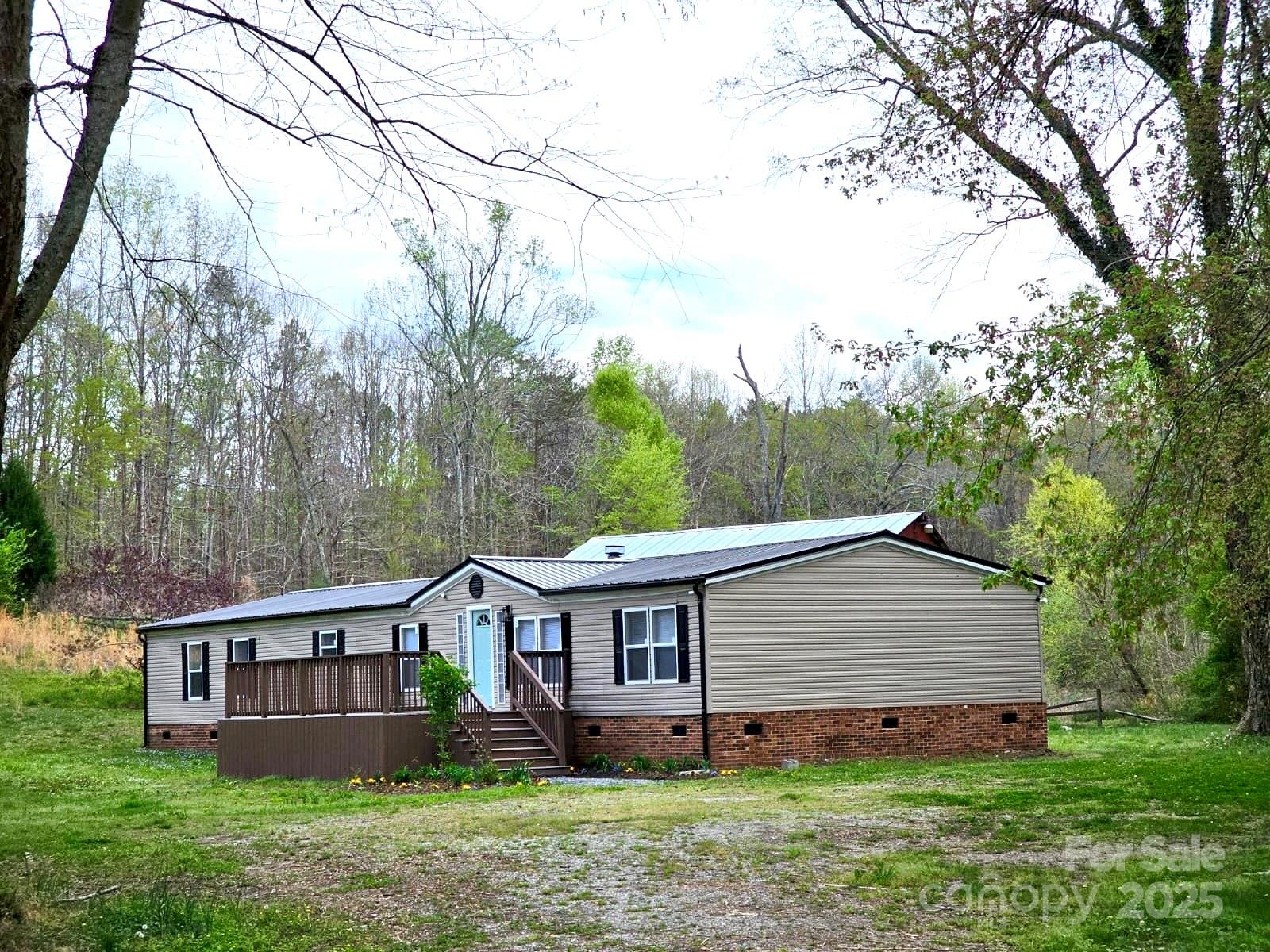 134 Watterson Road Grover, NC 28073 - Photo 19 of 19 a view of a house with a yard and large trees