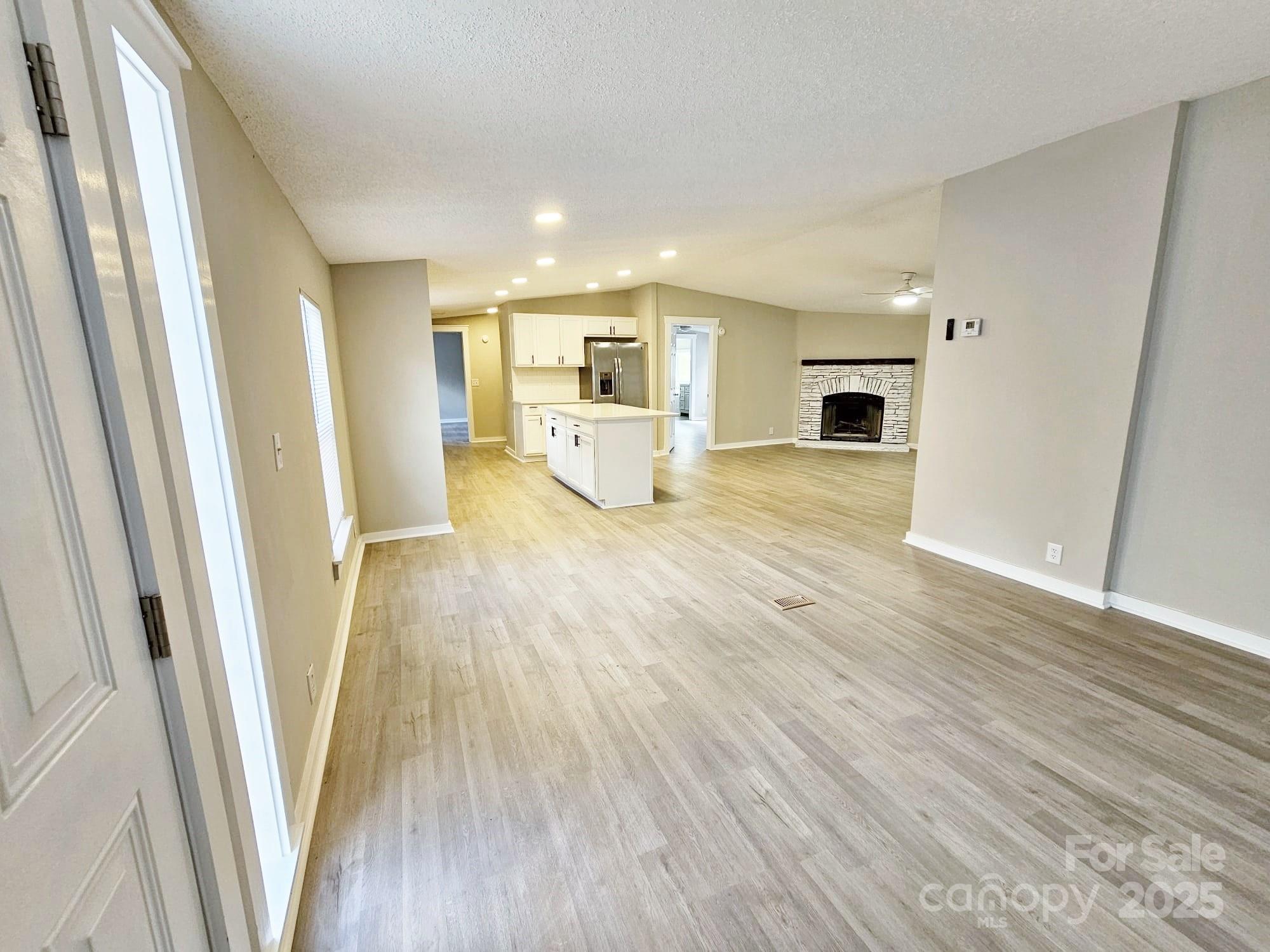 134 Watterson Road Grover, NC 28073 - Photo 5 of 19 a view of a kitchen with furniture and wooden floor