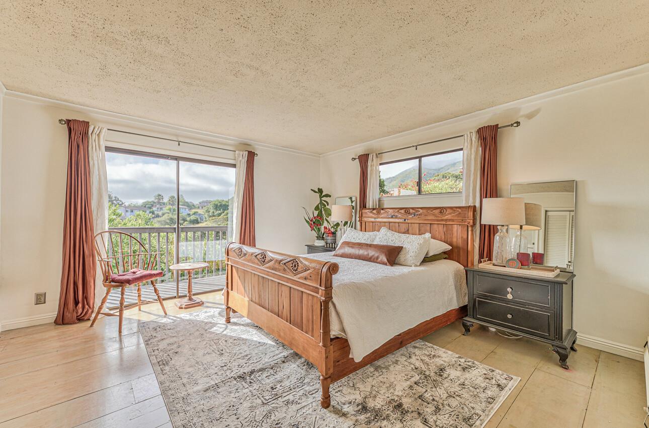 22607 Black Mountain Road Salinas, CA 93908 - Photo 16 of 36 a bed room with a bed and a large window