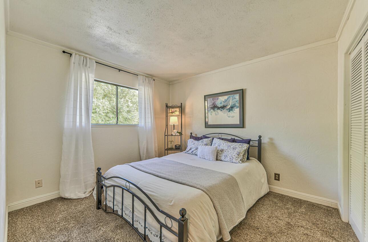 22607 Black Mountain Road Salinas, CA 93908 - Photo 20 of 36 a bedroom with a large bed and a window