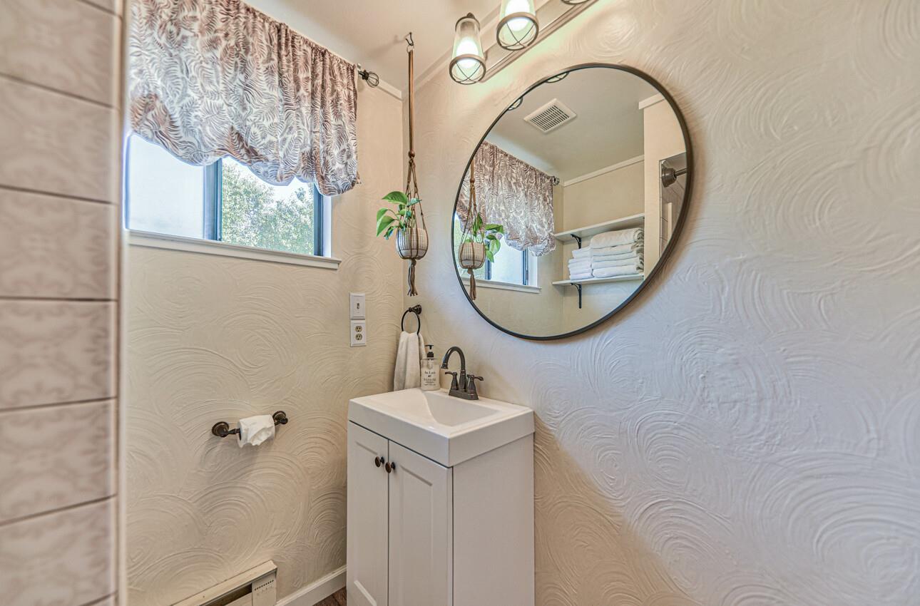 22607 Black Mountain Road Salinas, CA 93908 - Photo 24 of 36 a bathroom with a sink and a mirror