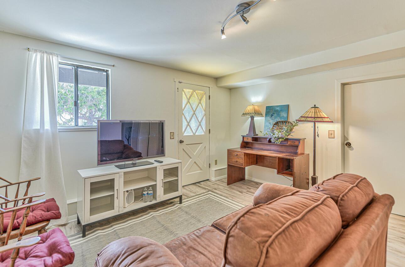 22607 Black Mountain Road Salinas, CA 93908 - Photo 25 of 36 a bedroom with a bed and a flat screen tv