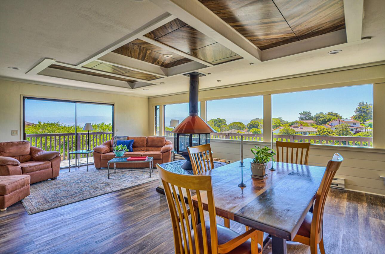 22607 Black Mountain Road Salinas, CA 93908 - Photo 10 of 36 a view of a dining room with furniture large windows and wooden floor