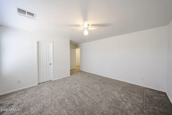 a view of an empty room with a window