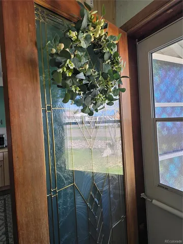 a kitchen with granite countertop a refrigerator and a stove