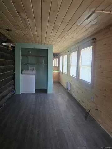a view of room with stairs and wooden floor