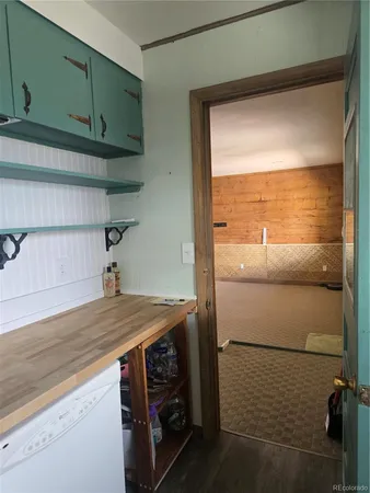 a kitchen with a sink cabinets and appliances