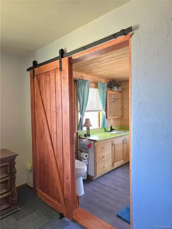 a room with wooden floor and furniture