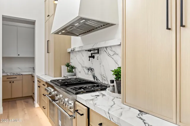 a bathroom with a sink a mirror and vanity